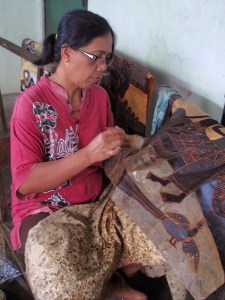 Woman working on the final waxing, before the last dye.