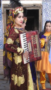 Song and Dance in Harem, Khiva, accordion player and dancer, Uzbekistan.